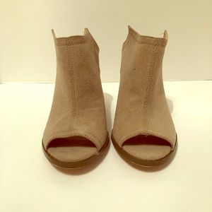 Size 9 1/2 Tan in color slip on, open toed